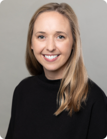 Professional headshot of a smiling Therapy Austin counselor with long blonde hair wearing a black top.