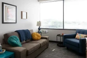 Comfortable counseling office at Therapy Austin featuring cozy seating, colorful accents, and natural light.
