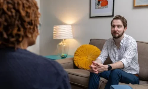 A young man opens up to his therapist about the challenges of mental health challenges